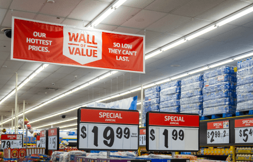 Picture of the Wall of Value sign in a store. Our hottest prices. So low they can't last. 